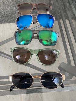 Sun Glasses . For Men  , Looks Like new  ,  all For