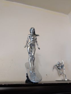 Platinum Cosmic Drifter (Riding)  12" Brilliant Chrome Resin Sculpture