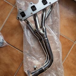 1(contact info removed) GEO TRACKER EXHAUST HEADER MANIFOLD 