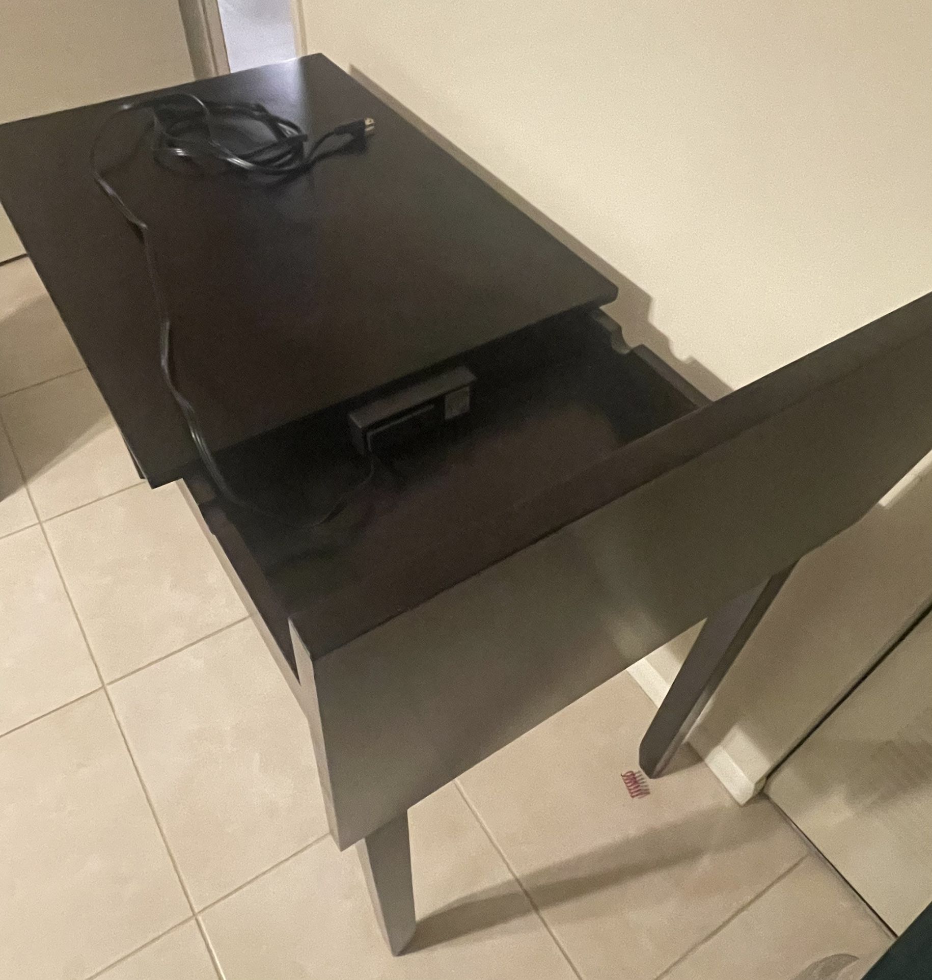 Desk with outlet cord and built in storage area