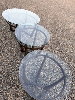 Two glass end tables w matching glass coffee table