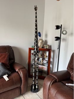 tall, hand-carved decorative giraffe