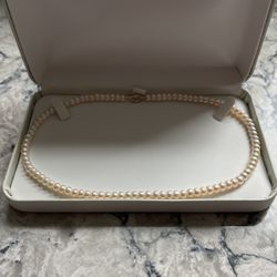 Pearl Necklace 17 1/4 Inches Long With 10 KT Gold Clasp.