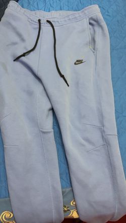 nike tech pants with small paint stain