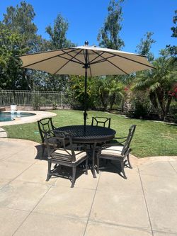 Restoration Hardware Antibes Outdoor Dining Table with Four Dining Armchairs