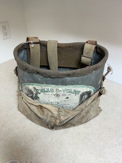 Vintagea Wells & Wade galvanized metal and canvas fruit picking bucket.