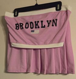 A two piece pleated skirt and top