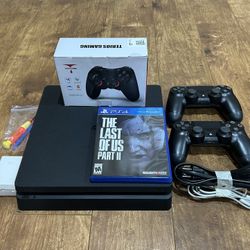 PS4 Console Bundle Lot, Ready to Play! 2 Dual Shock Controllers, Included TLOU Game & Cables + More