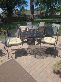 Black wrought iron tall table and 2 chairs