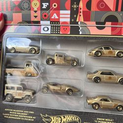 This is a Hot Wheels FAO Schwarz 160th Anniversary Gold 8-Pack vehicle set