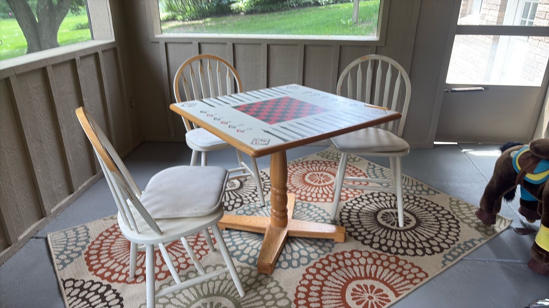 Game table with chairs. Perfect for playing chess, etc..