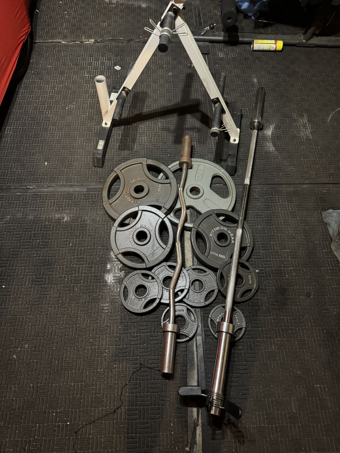 Olympic 6ft bar 35lbs plus 165lbs of Olympic weights and curl bar and weights tree