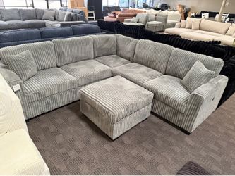 Light gray L shaped sectional and ottoman
