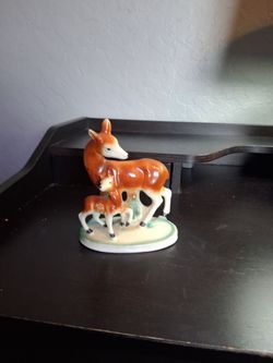 Antique mom and baby deer.