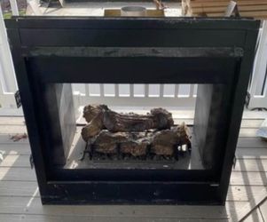 Double Sided Fireplace With 2 Mantles