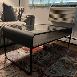 Rounded glass top coffee table