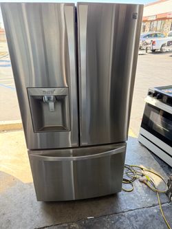 Counter depth Kenmore elite stainless steel French door refrigerator and bottom freezer