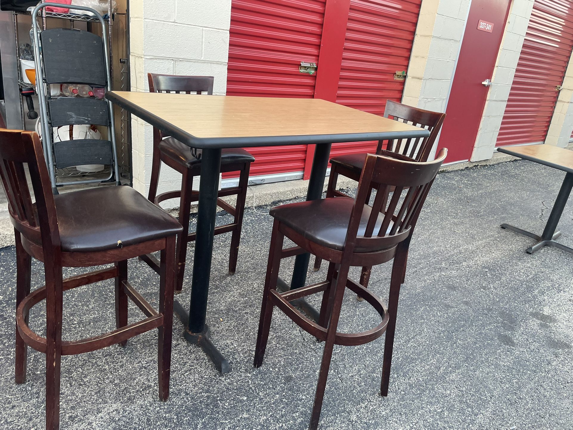 high table with 4 high chairs for restaurant.  
