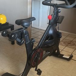 Peloton Exercise Bike and Shoes