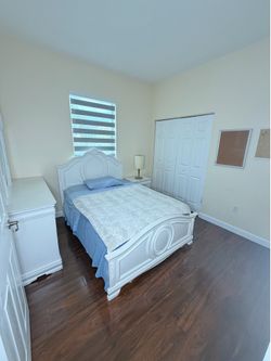 Full bed with mattress and mirror dresser