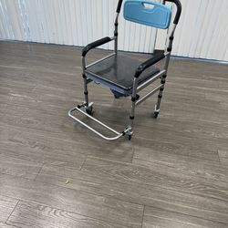 $40 Shower chair with wheels and commode / locking wheels