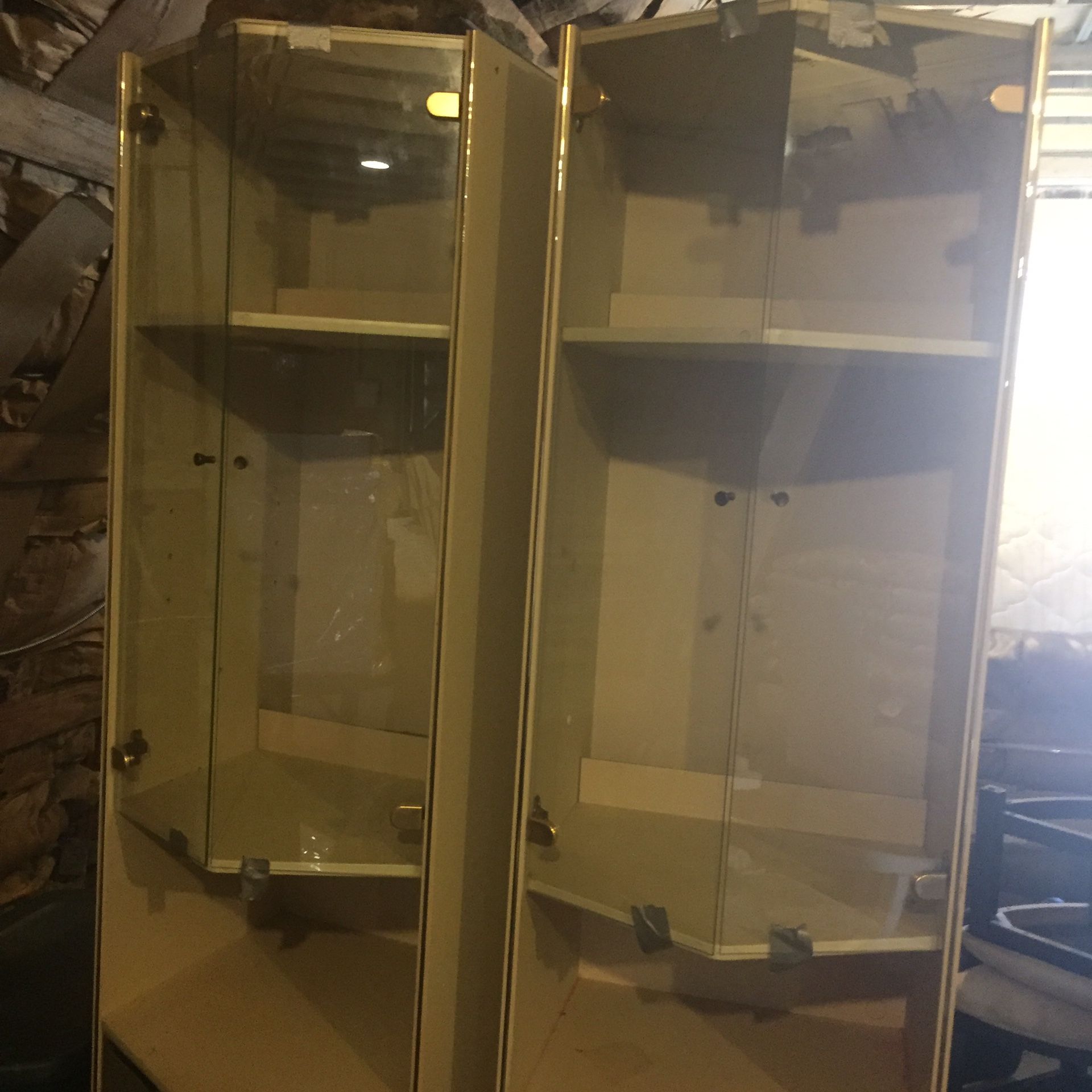 Cream colored glass light up cabinets