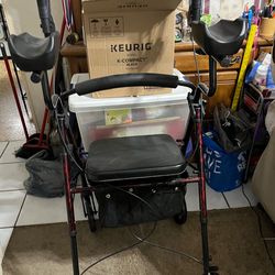 Upright walker with armrests, seat, basket, etc. Red swirl color