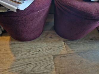 Upholstered storage footstool.