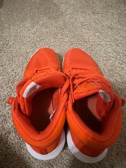 Nike LeBron Witness 8 TB (the "Team Bank" version), in orange and white.