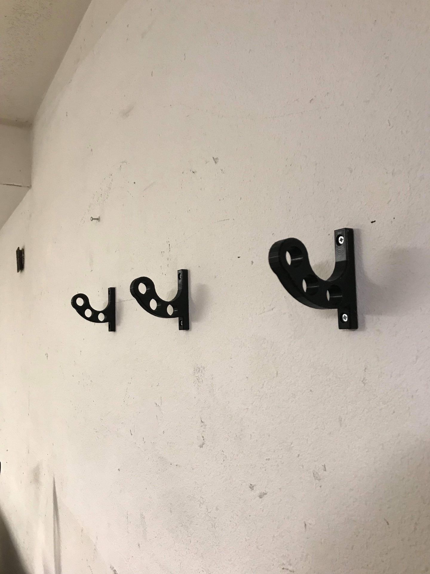 Wall mounted motorcycle stand, helmet, and accessories hanger