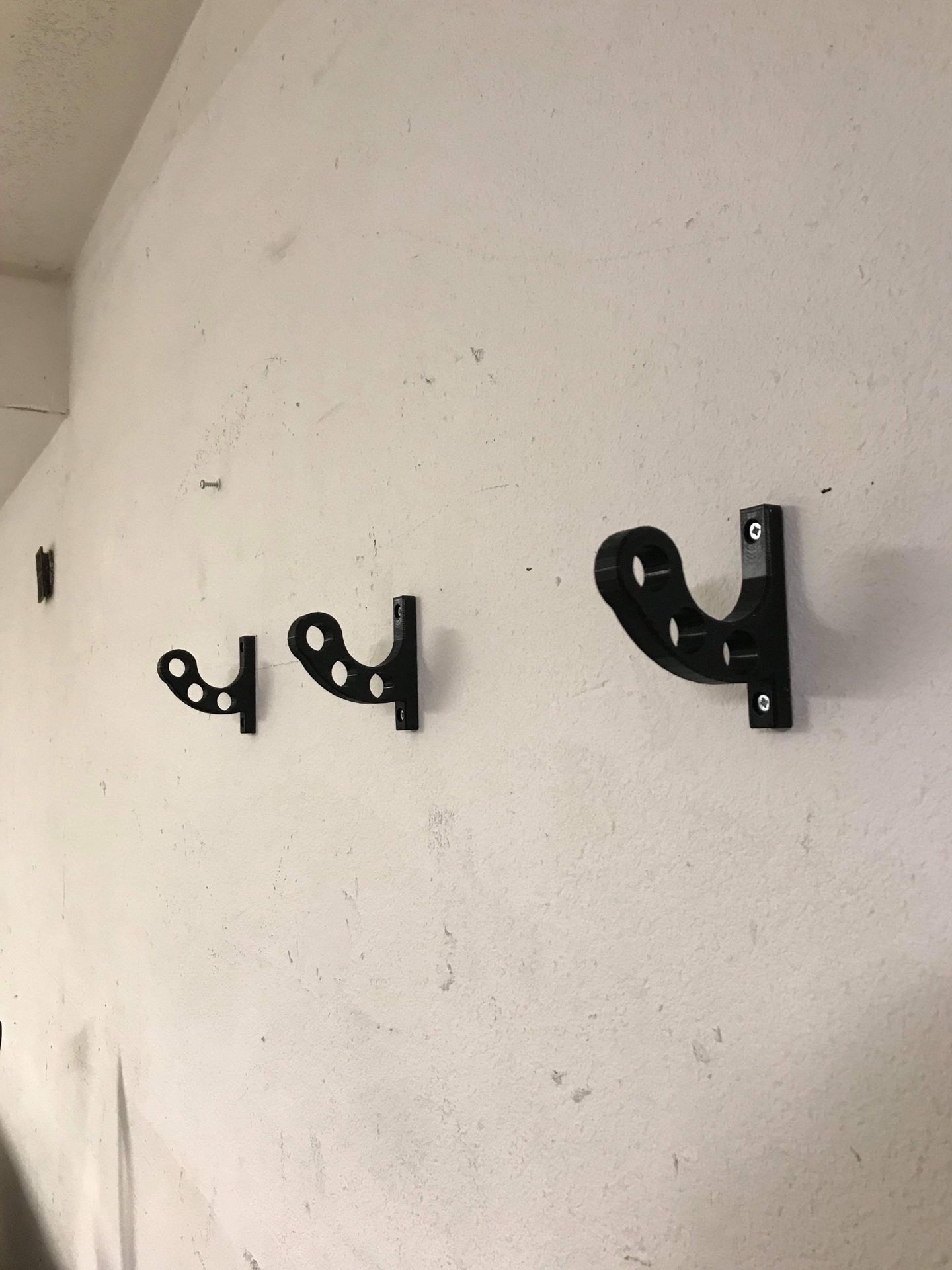 Wall mounted motorcycle stand, helmet, and accessories hanger