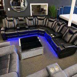 Power black leather reclining sectional sofa