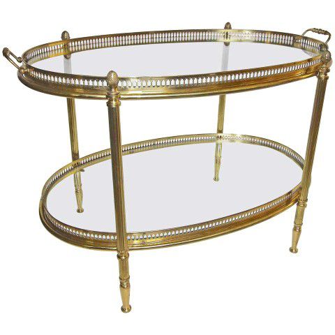 Oval two-tier brass French side table or tea table with removable glass inset tray at top. Nice detailing