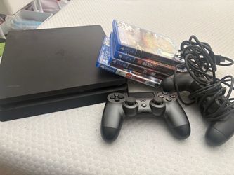 PlayStation with games & controllers