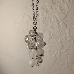 Silver tone necklace with hanging bead pendant