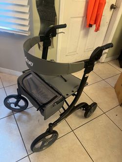 Drive Medical Nitro Euro Style Rollator, lightweight rolling walker with a seat and front storage bag.