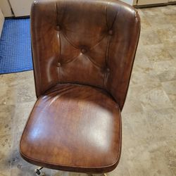 Table And Two Padded Rolling Chairs