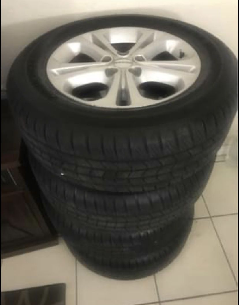 Set of 4 brand new tires with factory Dogde Durango rims