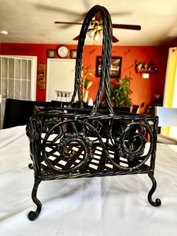WROUGHT IRON DECORATIVE BASKET .