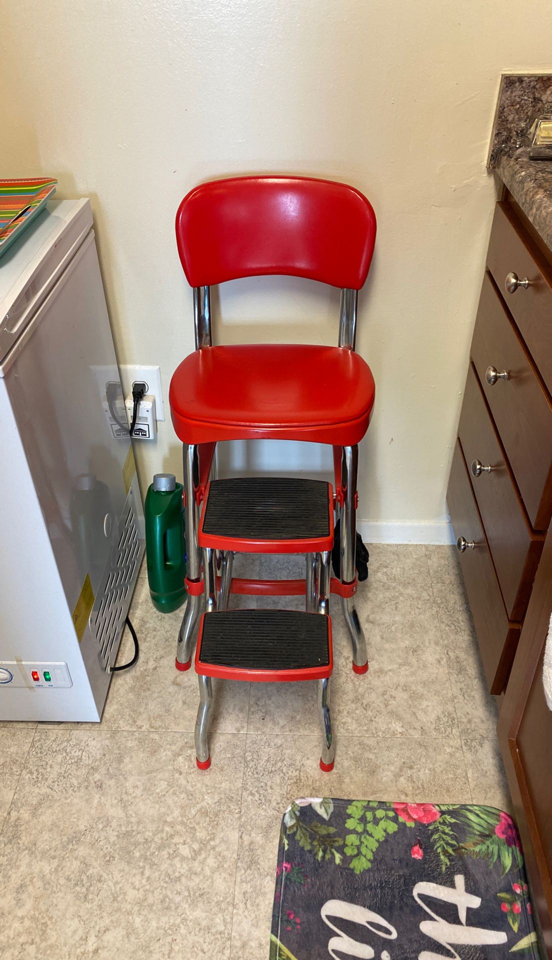 Red retro metal chair and step stool