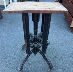 Antique Ebonized Pedestal Table with Gold Accents.