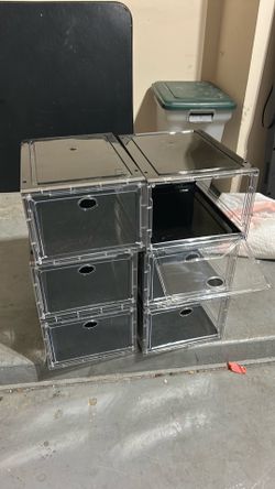 Clear and black shoe boxes.