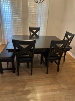 Kitchen table with chairs and a bench