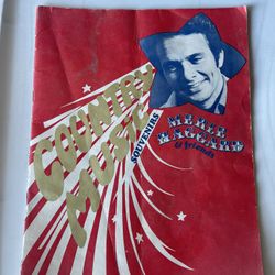 This is a vintage Merle Haggard & Friends, Country Music Souvenirs book.  It contains pages of black and white pictures and narratives about Merle Hag