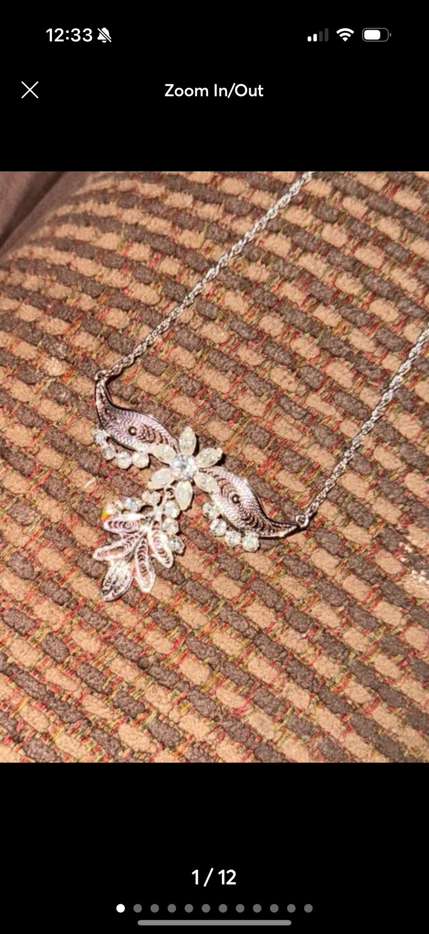 vintage rhinestone crystal brooch with a winged leafy flower design