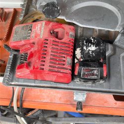 Used Milwaukee Battery 18 5.0 And Charger 