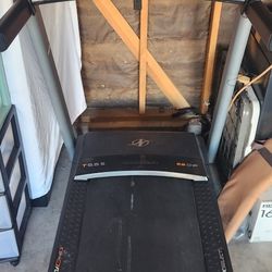 Exercise Equipment Treadmill And A Stationary Bike Both