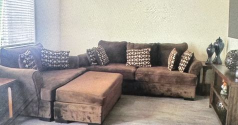 Brown couch and Chase/ w ottoman