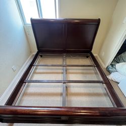 Bed frame with matching dressers and armoire