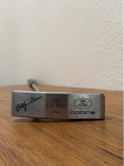 Cobra The Lo-Pro HSM men's putter in silver. Precision milled face for consistent roll and reliable accuracy. Classic design with Cobra branding for a